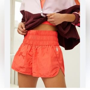 NWOT FREE PEOPLE MOVEMENT ORANGE THE WAY HOME SHORTS MEDIUM